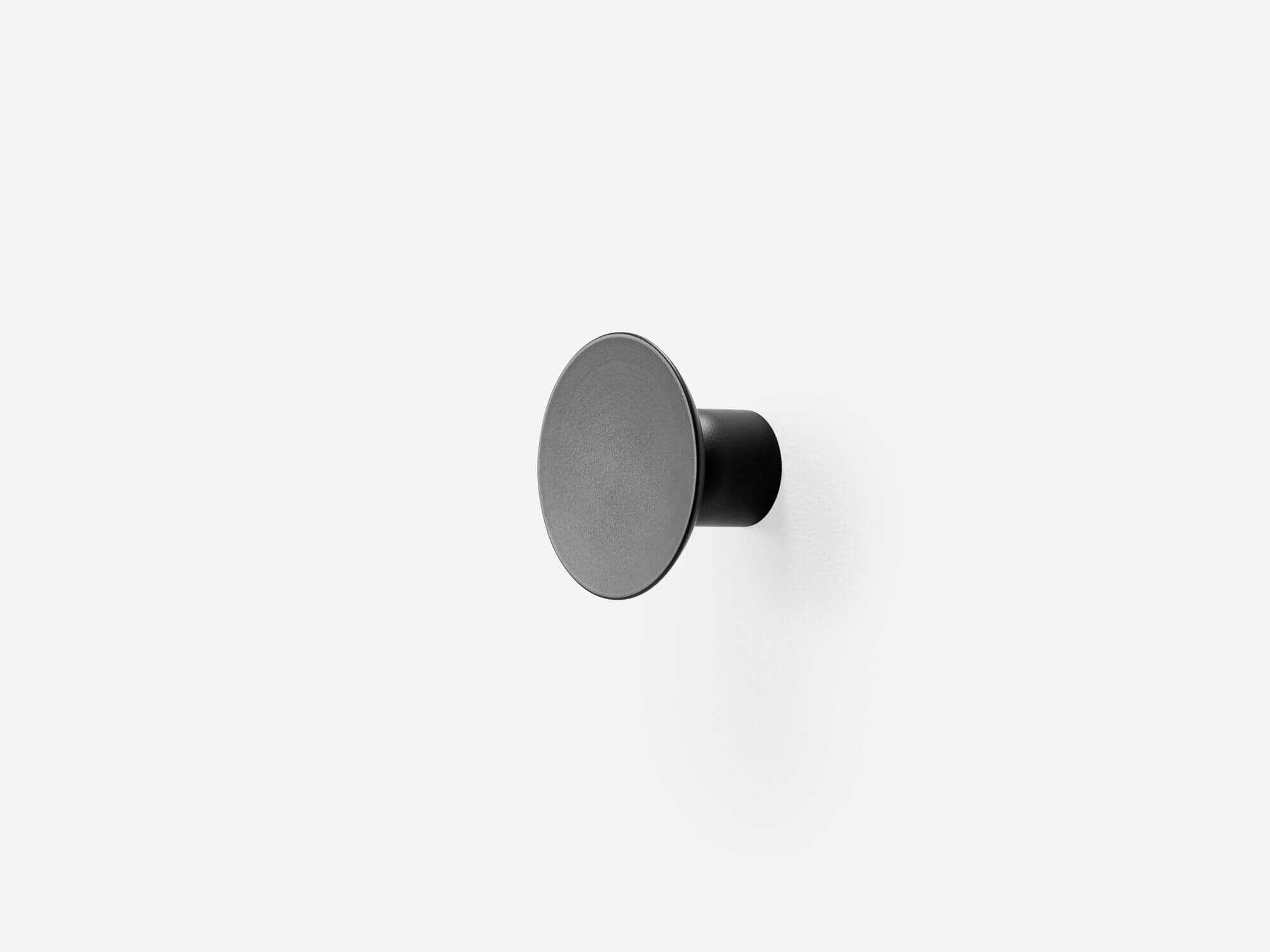 Front angle view of large black wall knob
